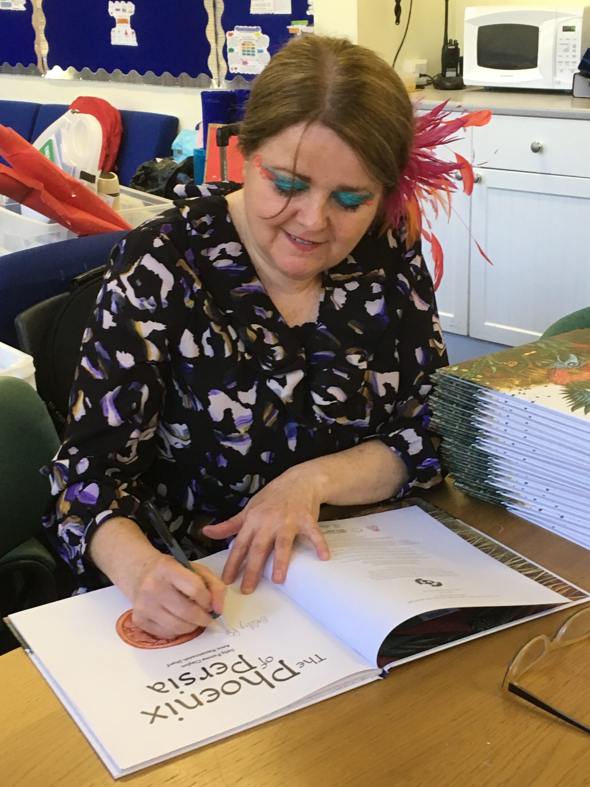 Photo of tutor at a book signing